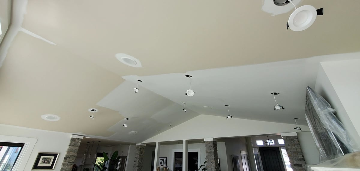 Before: Drywall patches around the pot lights, finished into one smooth white vault.